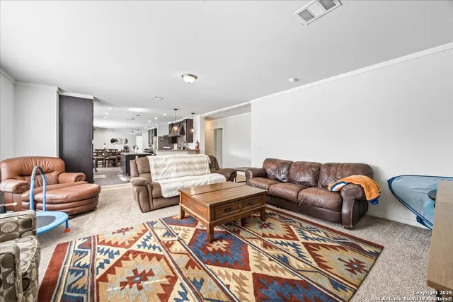 a living room with furniture a rug and a couch