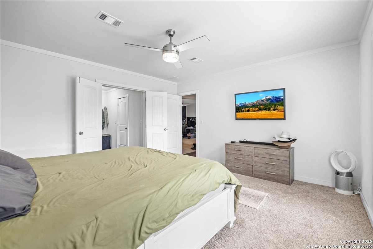 1291 Vivroux Ranch Road Seguin, TX 78155 - Photo 15 of 44 a bedroom with a bed dresser and window