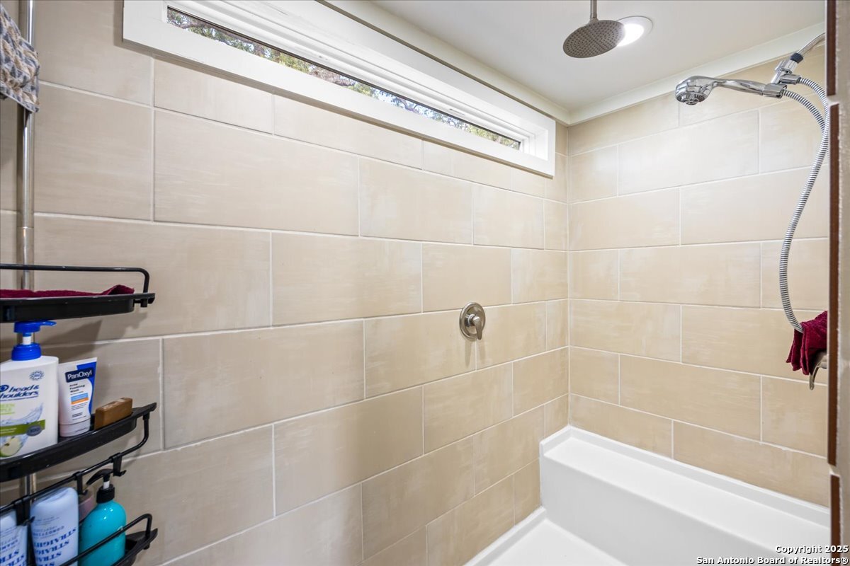 1291 Vivroux Ranch Road Seguin, TX 78155 - Photo 17 of 44 a bathroom with a shower and a toilet