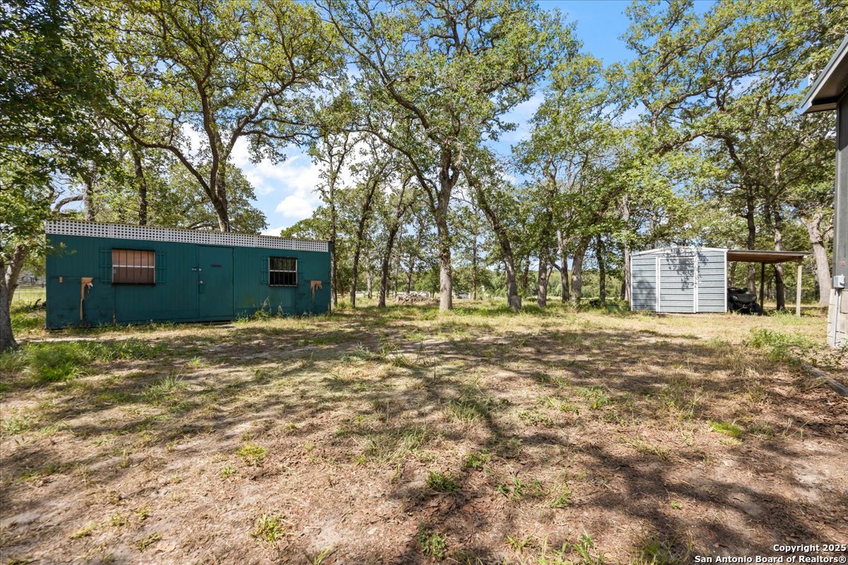 1291 Vivroux Ranch Road Seguin, TX 78155 - Photo 28 of 44 front view of a house with a yard