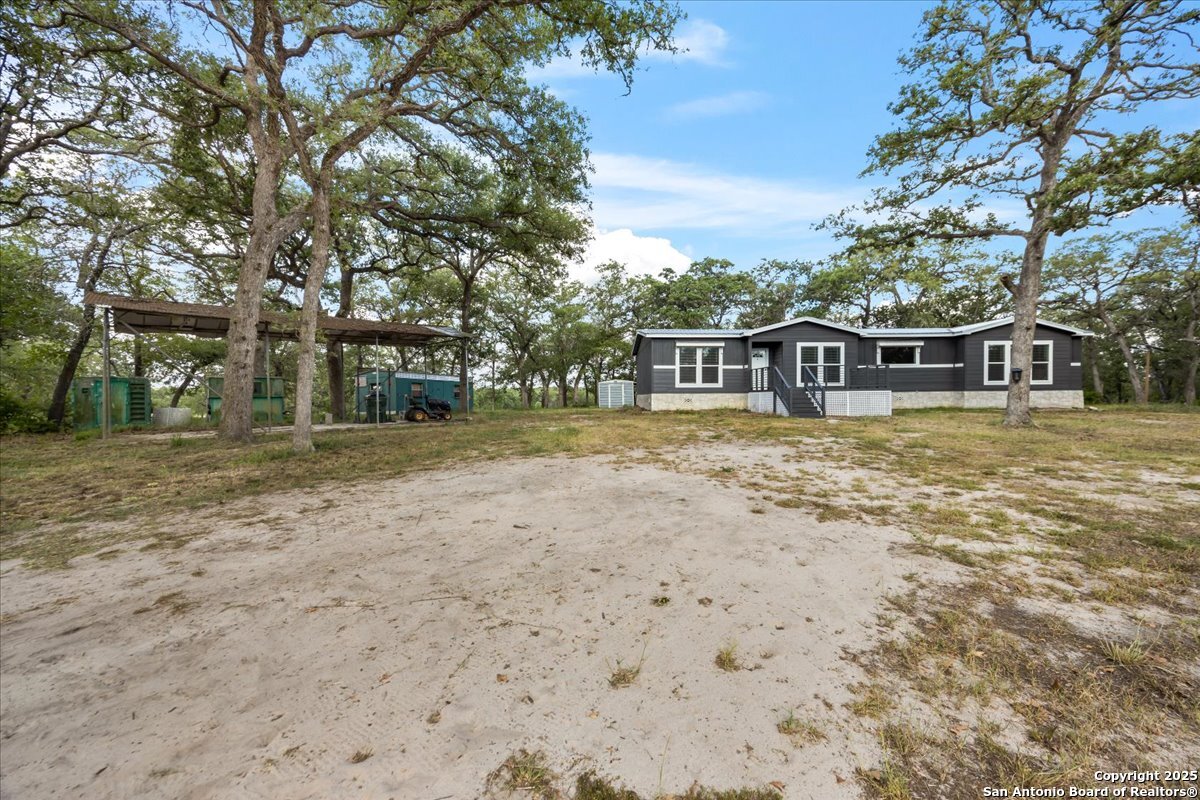 1291 Vivroux Ranch Road Seguin, TX 78155 - Photo 29 of 44 a view of a house with garden and trees
