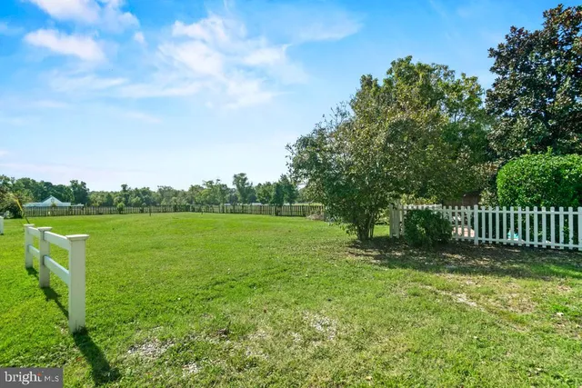 a view of a deck with a big yard