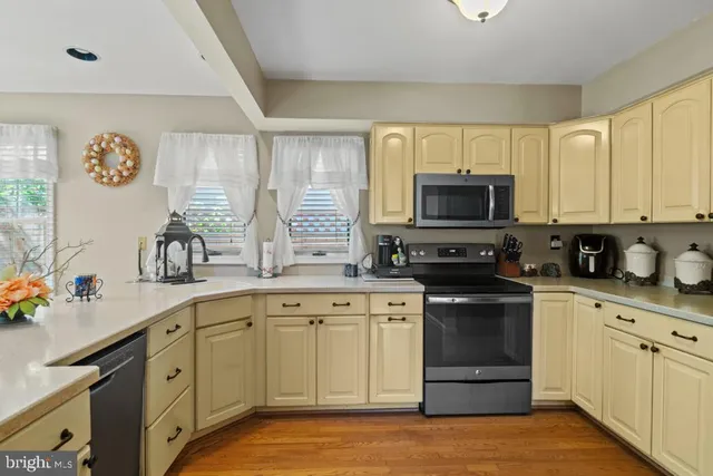 a kitchen with a sink stove and microwave
