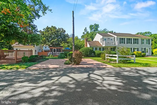 a view of a house with a yard and plants