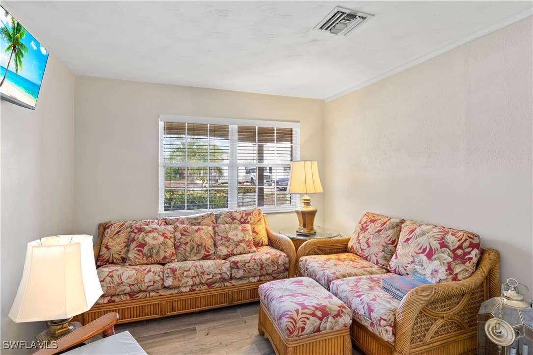 12206 Boat Shell Drive Matlacha Isles, FL 33991 - Photo 22 of 50 a living room with furniture and a large window