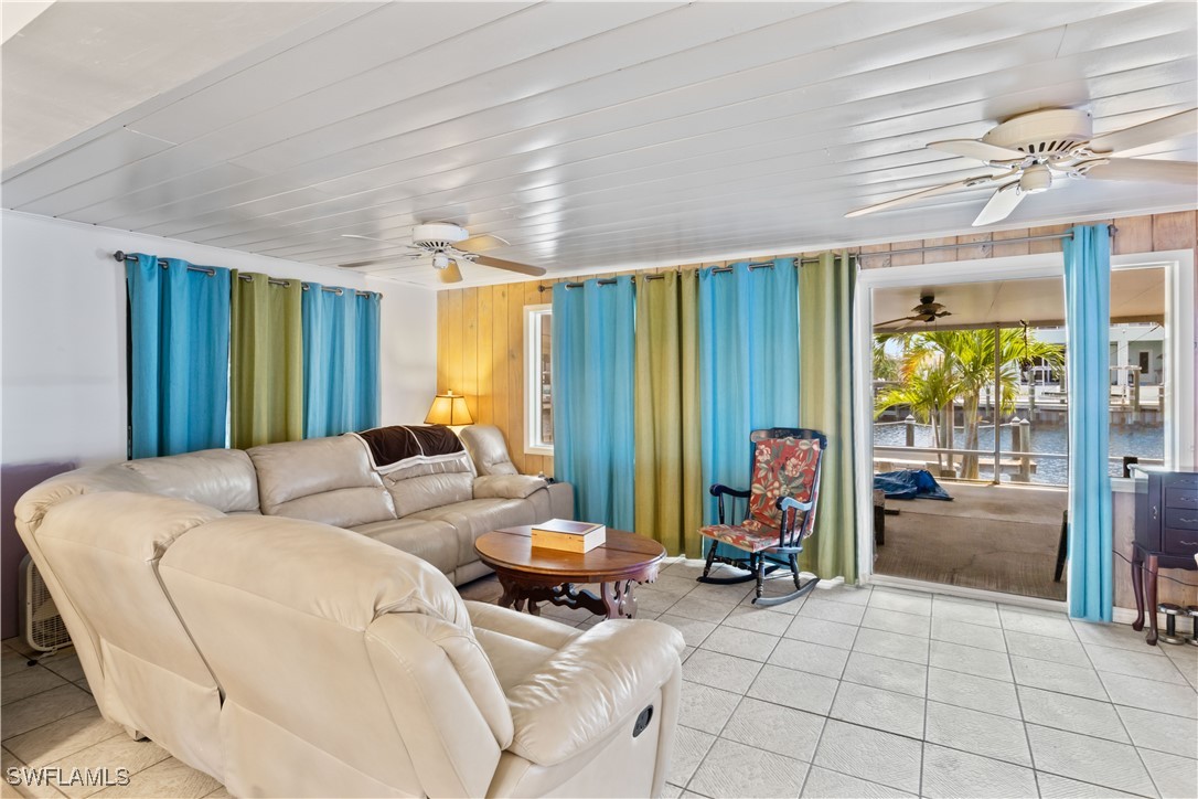 12206 Boat Shell Drive Matlacha Isles, FL 33991 - Photo 23 of 50 a living room with furniture and a large window