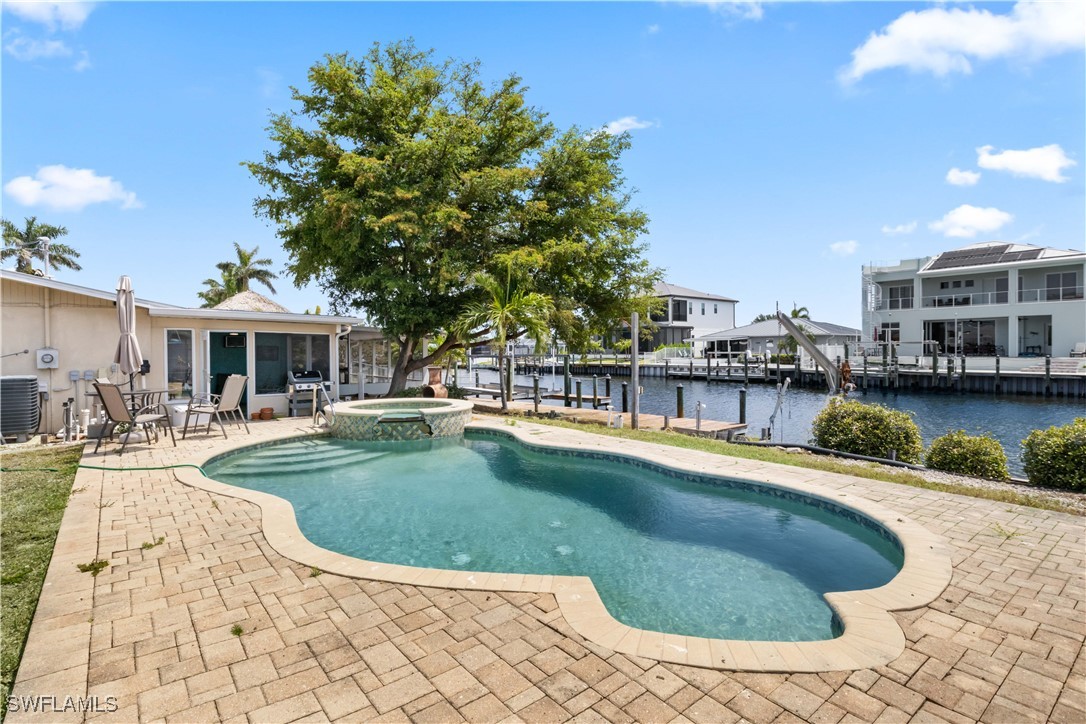 12206 Boat Shell Drive Matlacha Isles, FL 33991 - Photo 32 of 50 a view of a house with swimming pool and sitting area