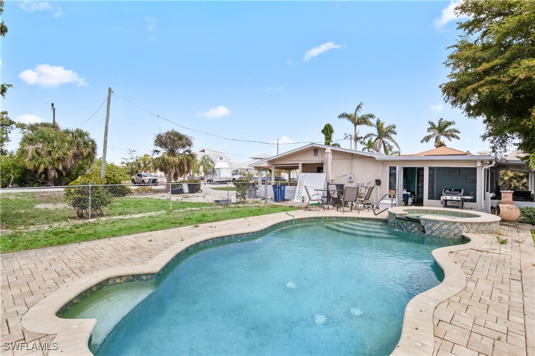 12206 Boat Shell Drive Matlacha Isles, FL 33991 - Photo 33 of 50 a view of a house with a yard porch and sitting area