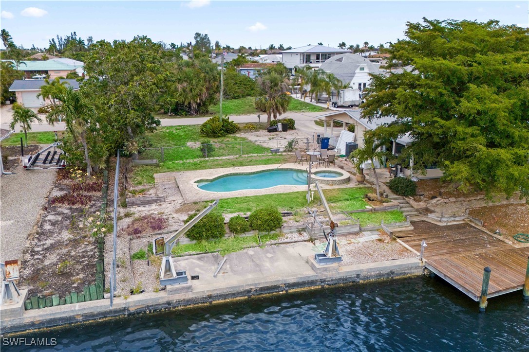 12206 Boat Shell Drive Matlacha Isles, FL 33991 - Photo 35 of 50 an aerial view of a house with a yard basket ball court and outdoor seating