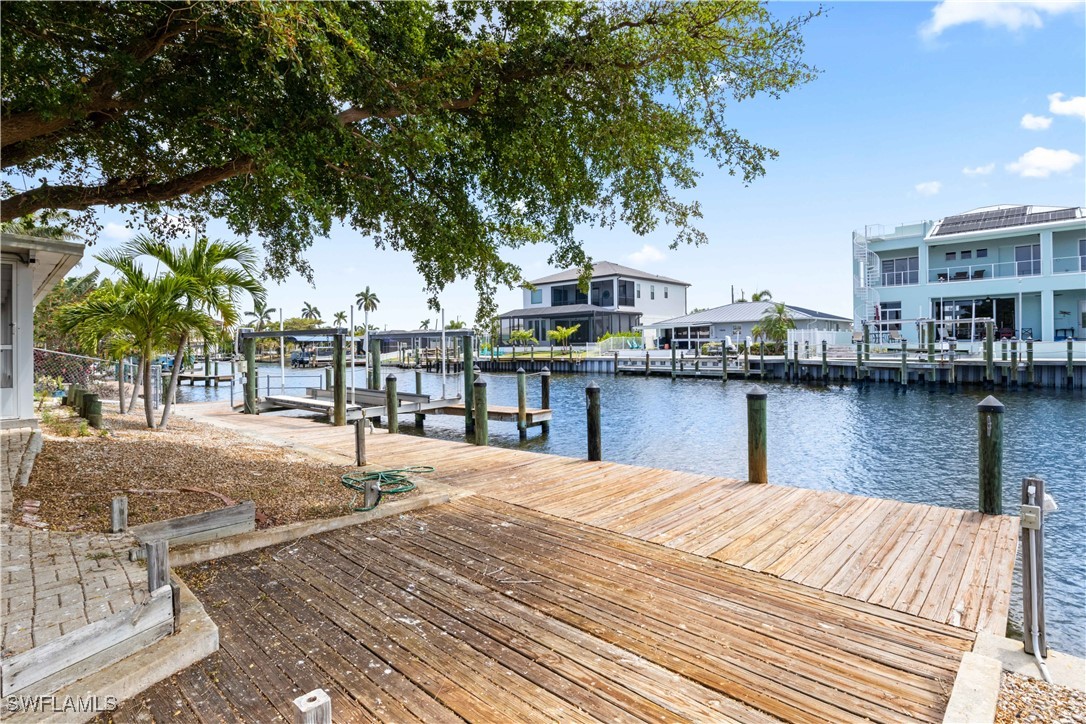 12206 Boat Shell Drive Matlacha Isles, FL 33991 - Photo 37 of 50 a swimming pool view with a lake view