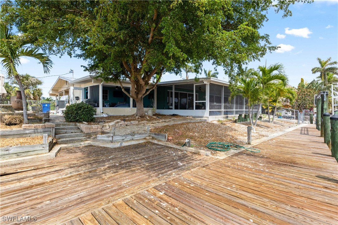 12206 Boat Shell Drive Matlacha Isles, FL 33991 - Photo 38 of 50 a front view of a house with a yard