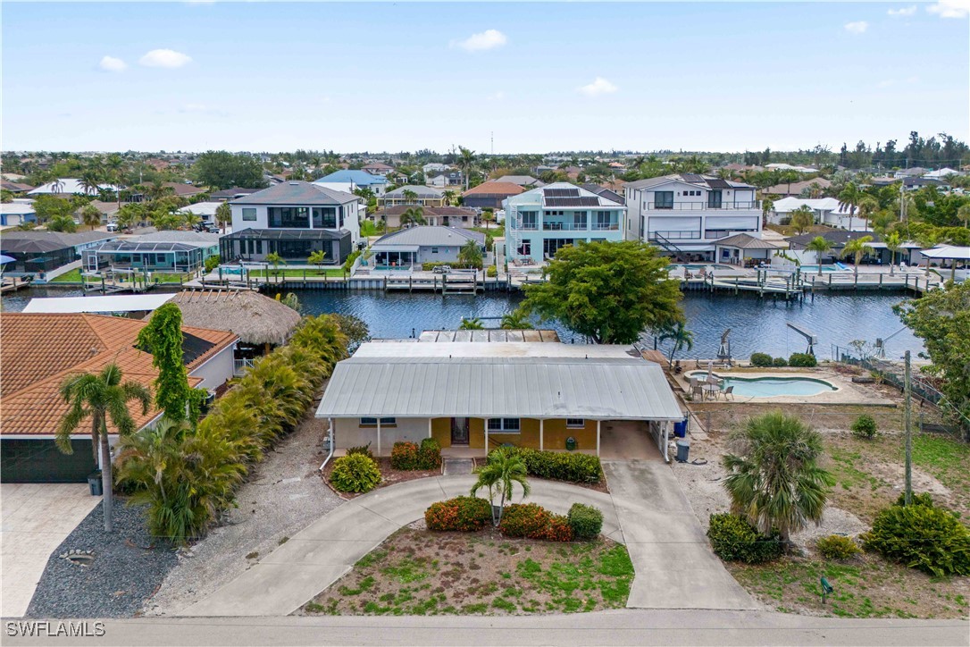 12206 Boat Shell Drive Matlacha Isles, FL 33991 - Photo 46 of 50 a view of a lake with a table and chairs
