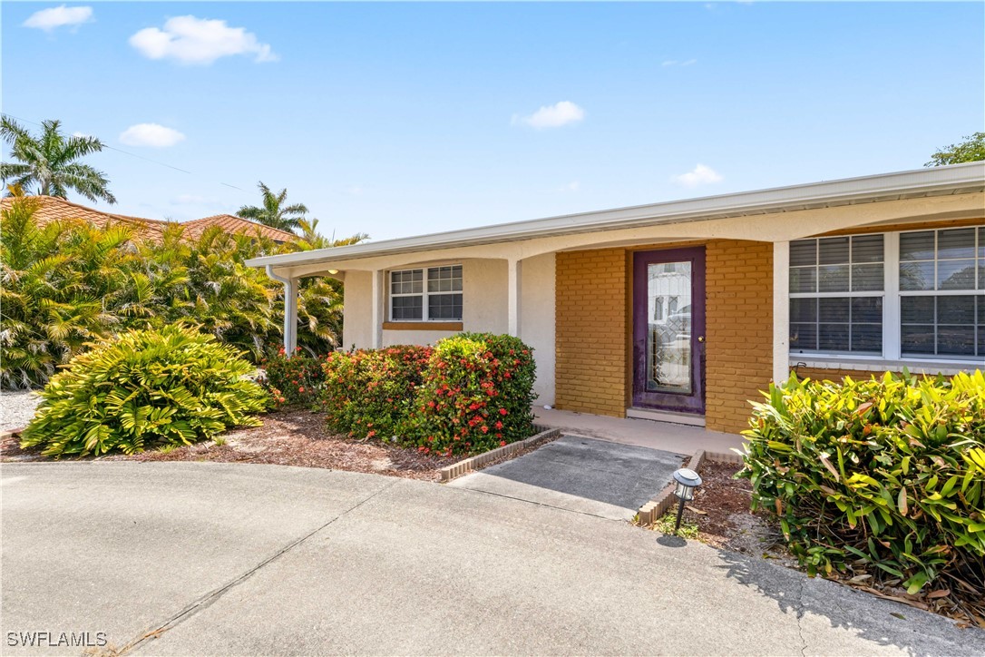 12206 Boat Shell Drive Matlacha Isles, FL 33991 - Photo 8 of 50 a front view of a house with garden