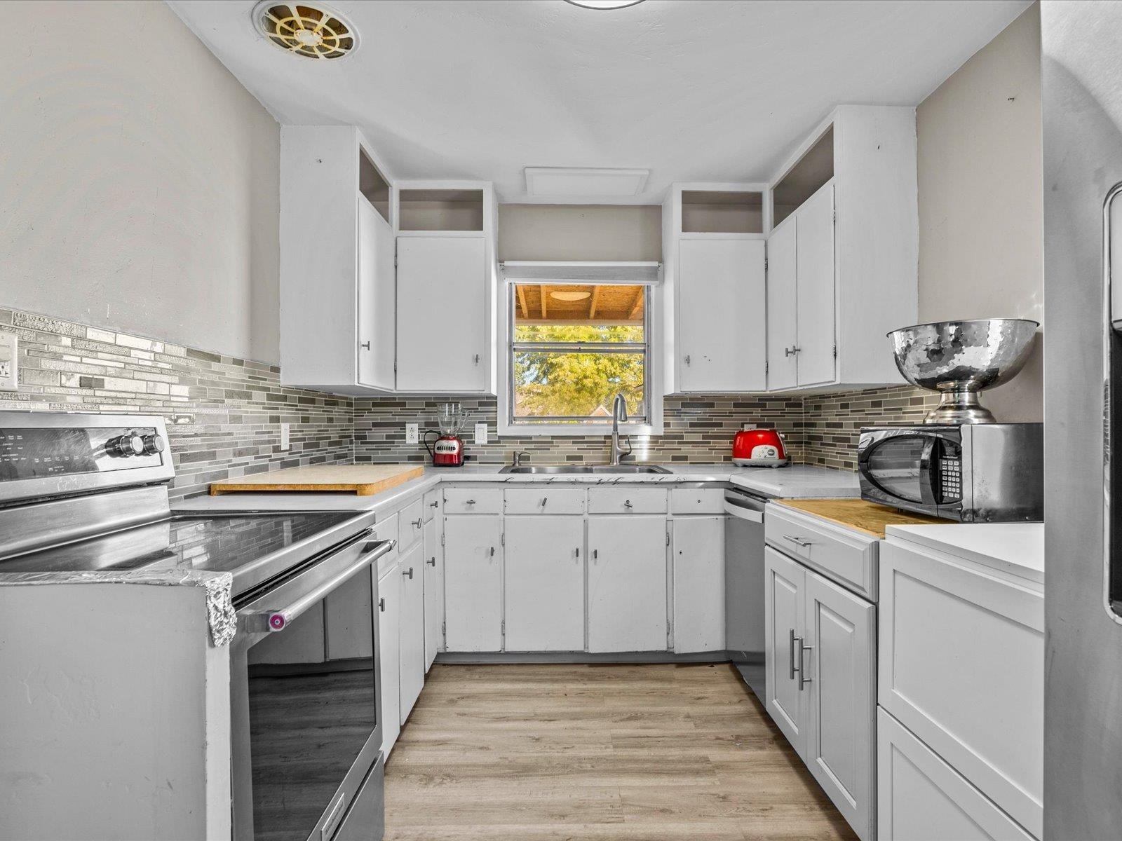 276 29 Road Grand Junction, CO 81503 - Photo 13 of 30 a kitchen with granite countertop cabinets sink and stainless steel appliances