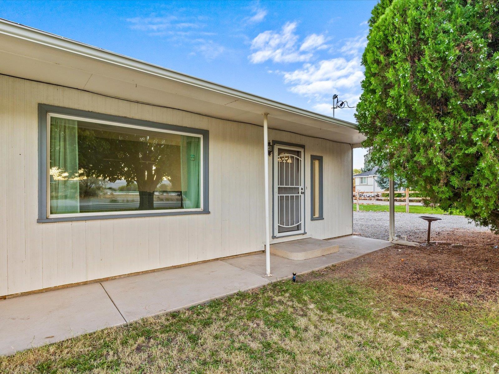 276 29 Road Grand Junction, CO 81503 - Photo 8 of 30 a front view of a house with a yard