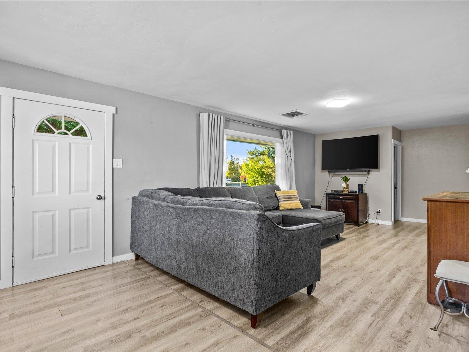 276 29 Road Grand Junction, CO 81503 - Photo 9 of 30 a living room with furniture and a flat screen tv