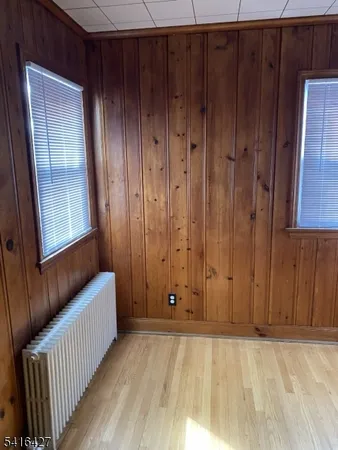 a view of room with wooden floor