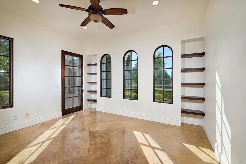 4216 Bridlewood Road Fallbrook, CA 92028 - Photo 31 of 71 a view of an empty room with a window and a ceiling fan