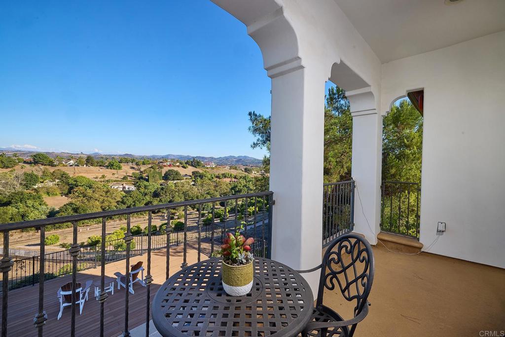 4216 Bridlewood Road Fallbrook, CA 92028 - Photo 39 of 71 a view of a balcony with chairs and a potted plant