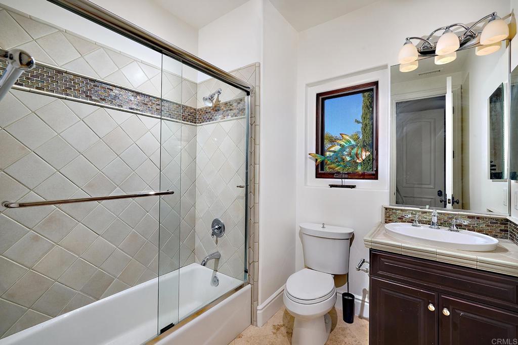 4216 Bridlewood Road Fallbrook, CA 92028 - Photo 44 of 71 a bathroom with a sink toilet and shower