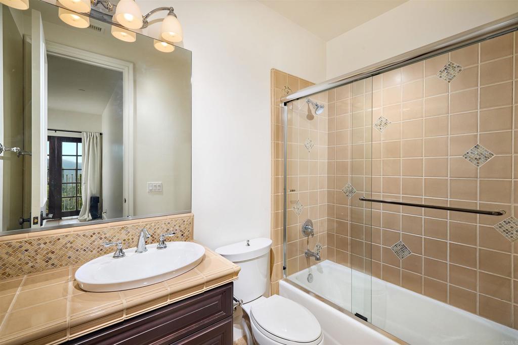 4216 Bridlewood Road Fallbrook, CA 92028 - Photo 47 of 71 a bathroom with a sink a toilet and shower