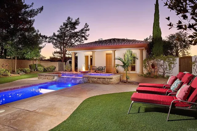 a view of a patio with swimming pool table and chairs