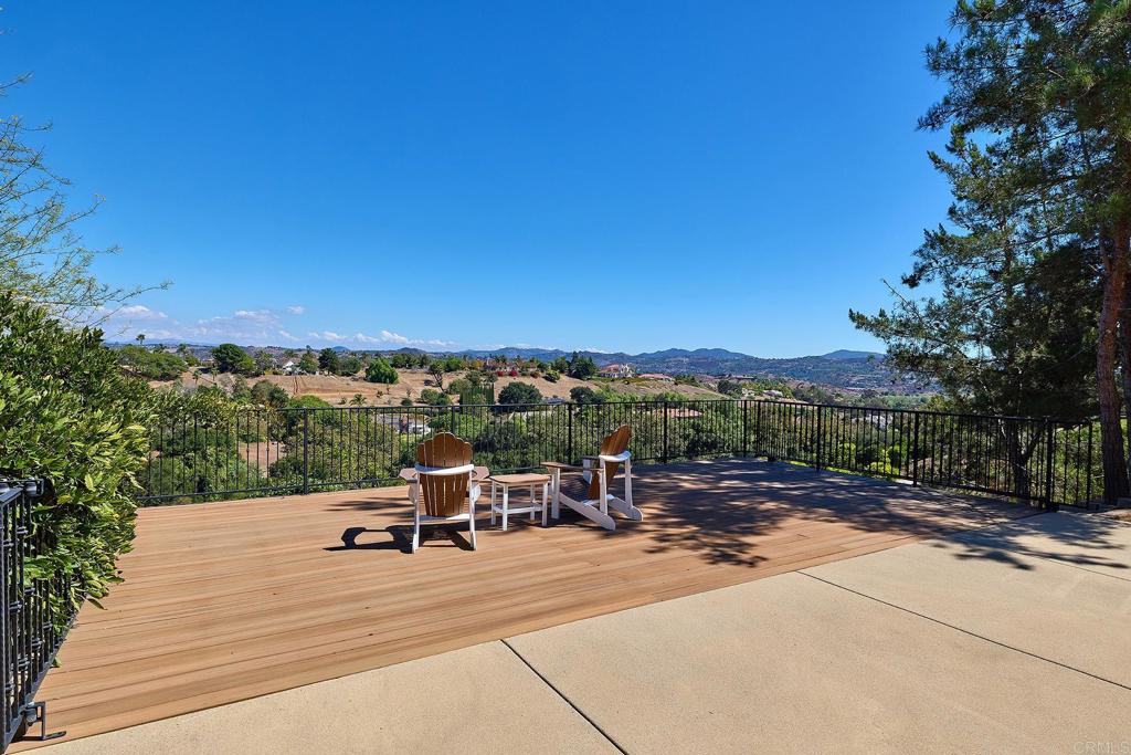 4216 Bridlewood Road Fallbrook, CA 92028 - Photo 68 of 71 a view of a patio with a table under an umbrella