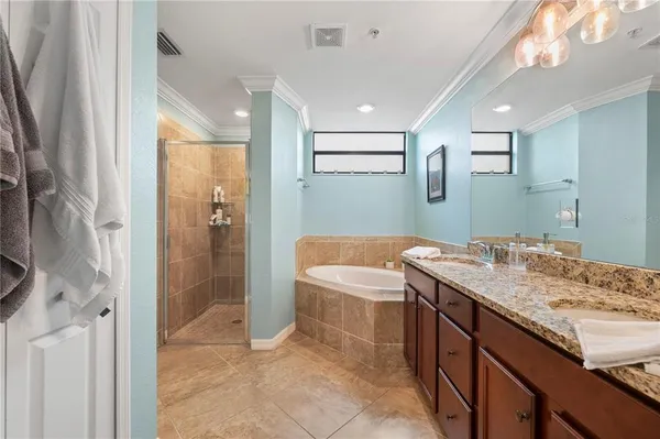 a view of a hallway with a livingroom and a bathroom