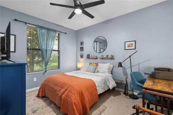 a bedroom with a bed and furniture