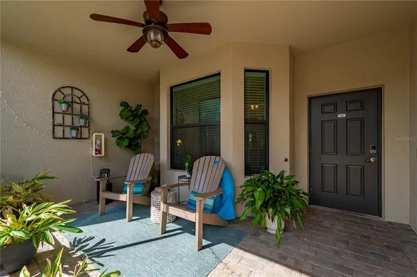 a living room with patio furniture