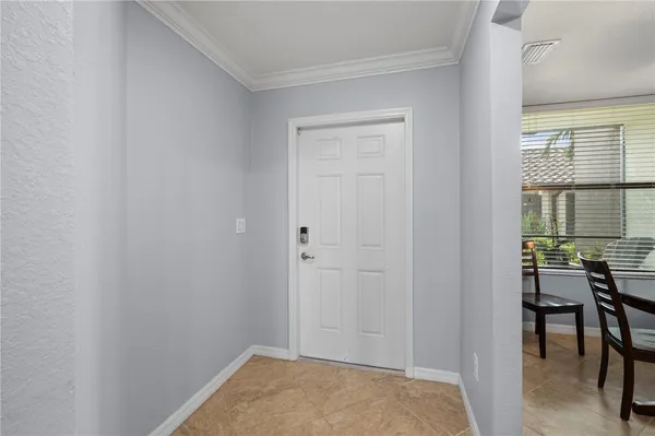 a view of a dining room with furniture window and outside view