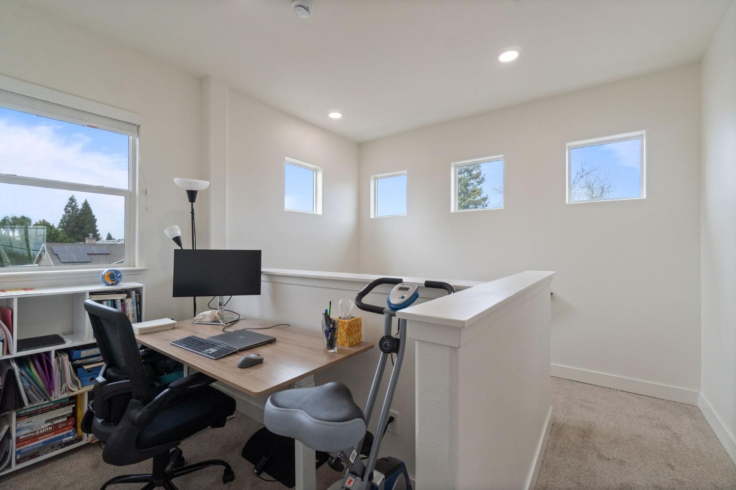 1732 North Avignon Lane Clovis, CA 93619 - Photo 15 of 28 a view of a workspace with furniture and a window