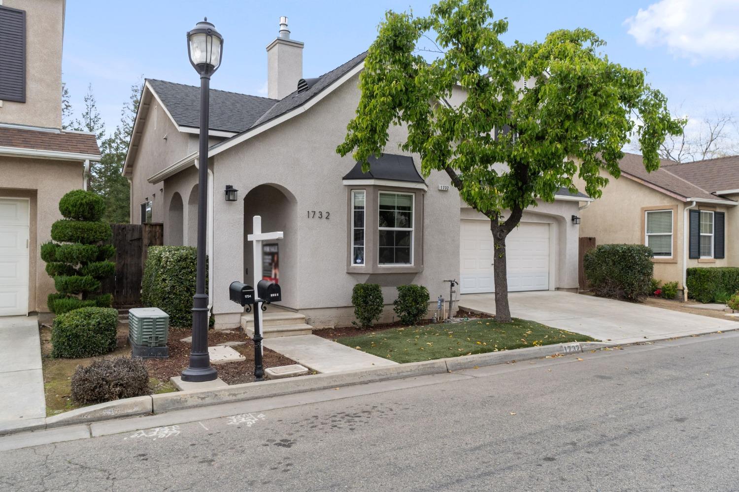 1732 North Avignon Lane Clovis, CA 93619 - Photo 3 of 28 a front view of a house with garden