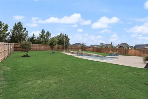 a view of a lake with a yard