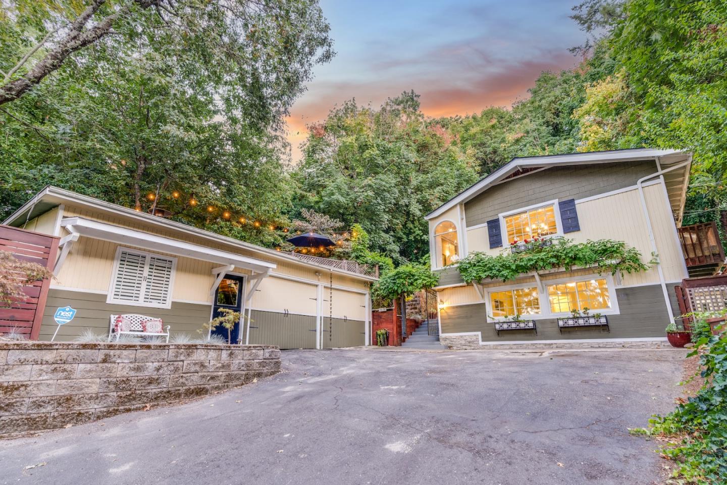 a front view of a house with a yard and a garage