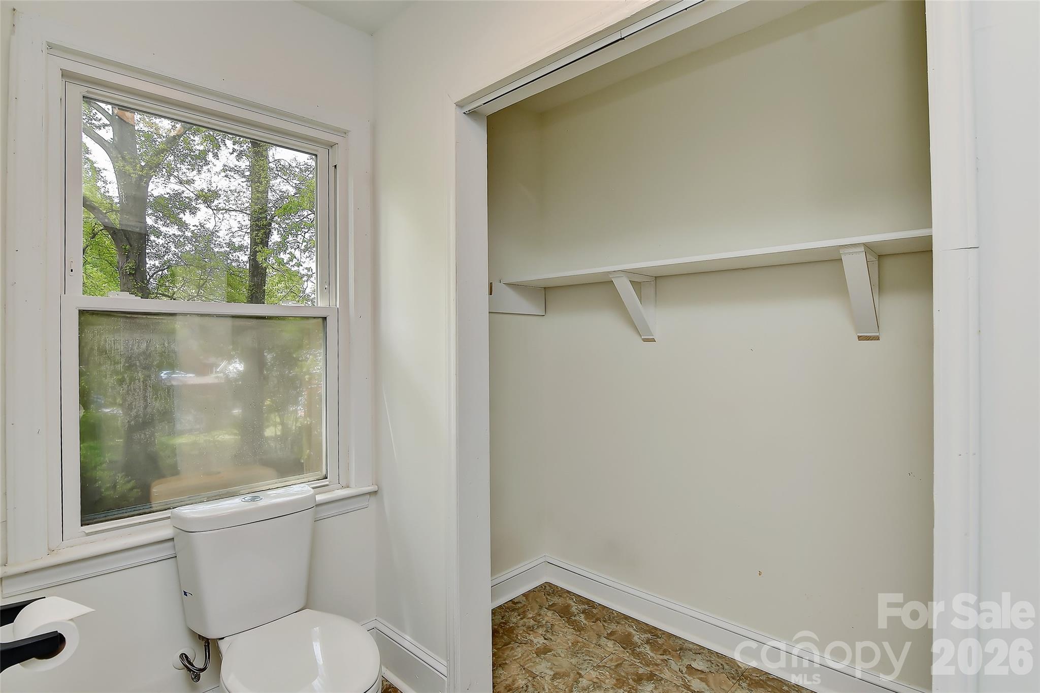 961 Clanton Road Charlotte, NC 28217 - Photo 11 of 23 a bathroom with a toilet and a shower