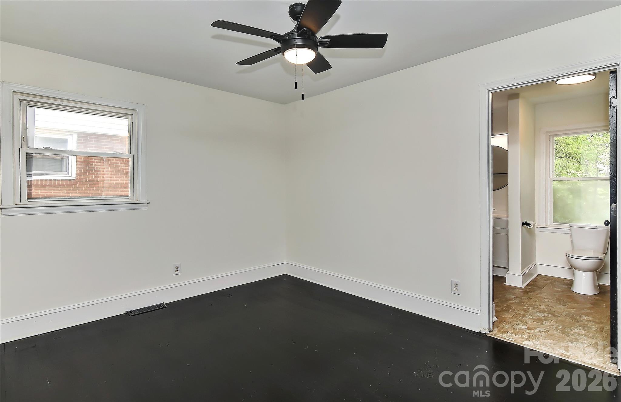 961 Clanton Road Charlotte, NC 28217 - Photo 16 of 23 a view of an empty room and window