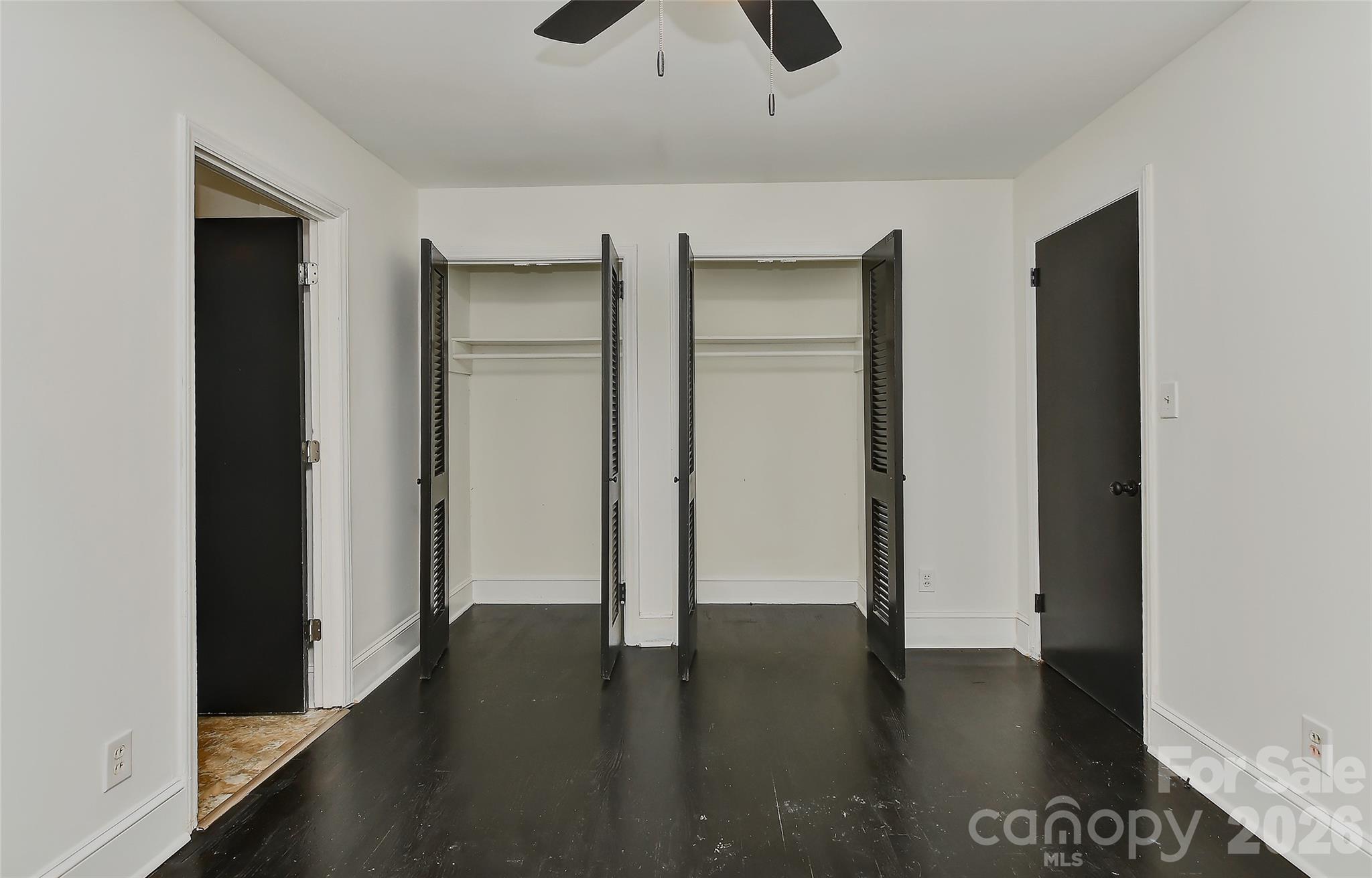 961 Clanton Road Charlotte, NC 28217 - Photo 9 of 23 a view of an empty room with wooden floor