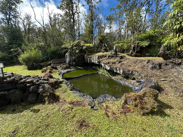 a view of a lake with a yard