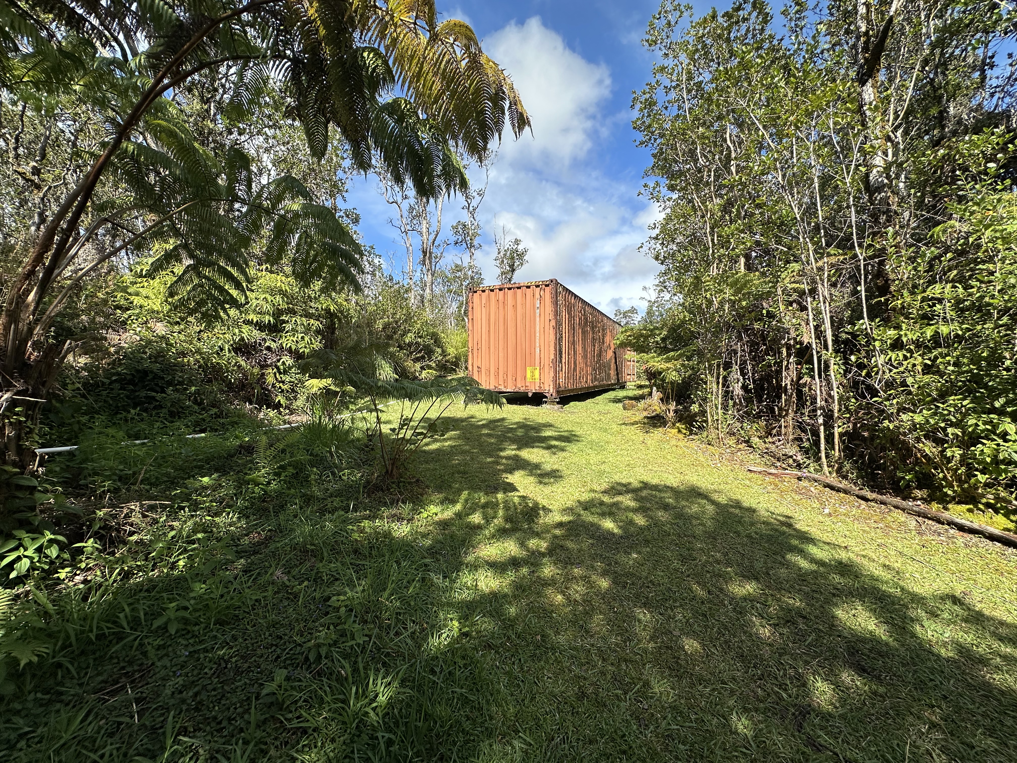 11-3003 Kahaualea Road Volcano, HI 96771 - Photo 4 of 25 a backyard of a house with table and chairs