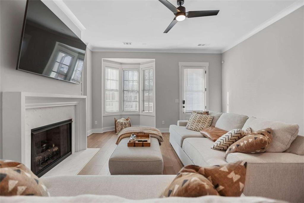 4466 Lemon Street Acworth, GA 30101 - Photo 15 of 65 a living room with furniture fireplace and a flat screen tv