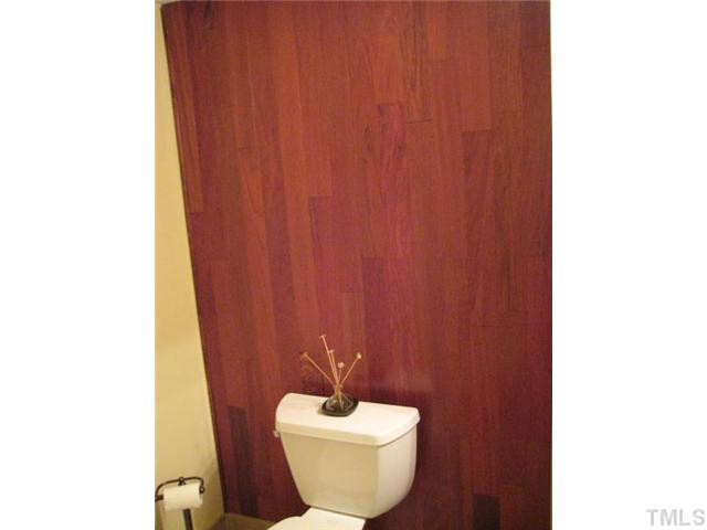 6904 Brecken Ridge Avenue Raleigh, NC 27615 - Photo 14 of 25 Even the toilet itself is surrounded by beauty. Your guests will be very impressed with your stylish guest bath room.