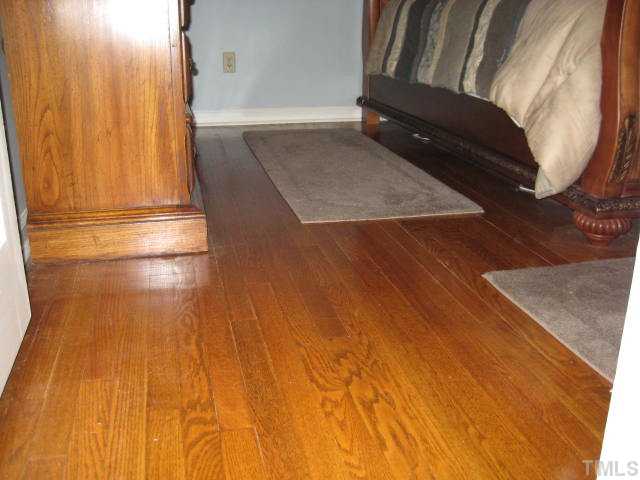 6904 Brecken Ridge Avenue Raleigh, NC 27615 - Photo 17 of 25 Each bedroom up a short flight of stairs has gleaming real wood floors.
