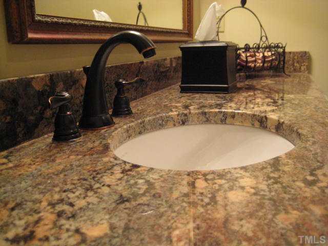 6904 Brecken Ridge Avenue Raleigh, NC 27615 - Photo 18 of 25 Two full baths also have beautiful granite countertops...