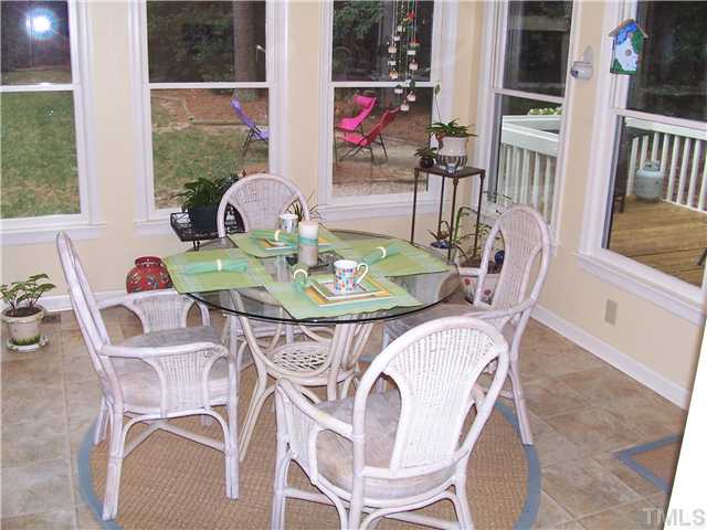 6904 Brecken Ridge Avenue Raleigh, NC 27615 - Photo 22 of 25 Start your morning off right with breakfast in this sunny Sun Room.