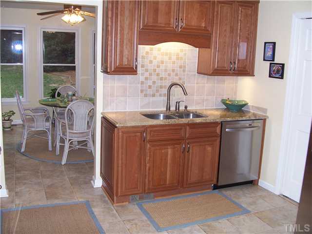 6904 Brecken Ridge Avenue Raleigh, NC 27615 - Photo 3 of 25 This kitchen just can't fit into one picture! The undermount sink with granite countertops boasts snazzy new fixtures. You'll be amazed at the quiet state of the art dishwasher. This kitchen feels like a $1M home!