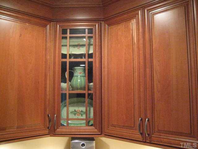6904 Brecken Ridge Avenue Raleigh, NC 27615 - Photo 4 of 25 Custom Cherry Cabinets make this kitchen special.