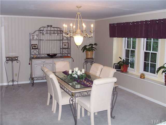 6904 Brecken Ridge Avenue Raleigh, NC 27615 - Photo 7 of 25 Large sunny dining room can accomodate your extra big table and hutch.