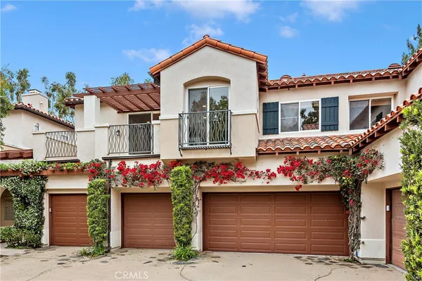 a front view of a house with a garage