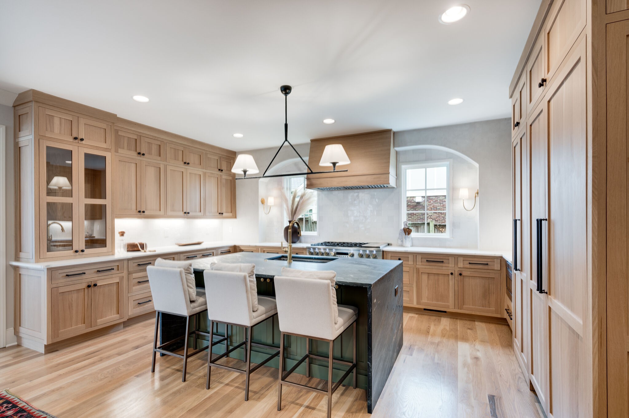 1818 Cedar Lane Nashville, TN 37212 - Photo 19 of 70 a kitchen with stainless steel appliances granite countertop a sink a stove a refrigerator and chairs